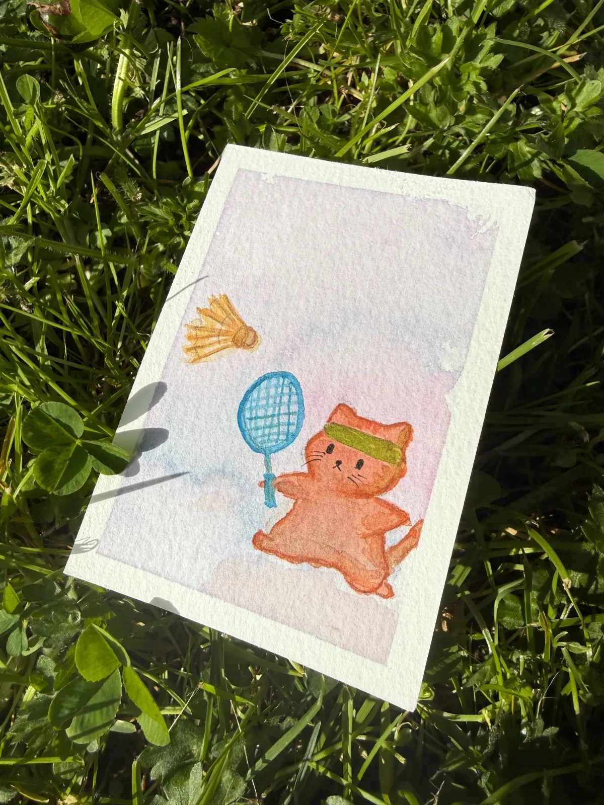 Cat playing badminton in his dreams
